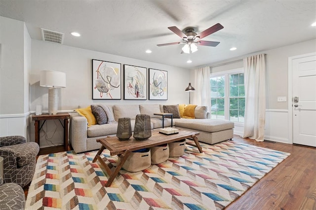 2633 Chaucer Dr, The Village, OK 73120 - living area featuring wood finished floors, a ceiling fan, a wainscoted wall, and recessed lighting