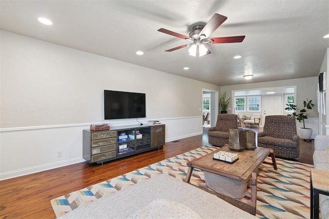 2633 Chaucer Dr, The Village, OK 73120 - living room featuring wood finished floors, ceiling fan, wainscoting, and recessed lighting