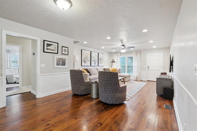 2633 Chaucer Dr, The Village, OK 73120 - living room featuring a textured ceiling, dark wood-style floors, a ceiling fan, and recessed lighting