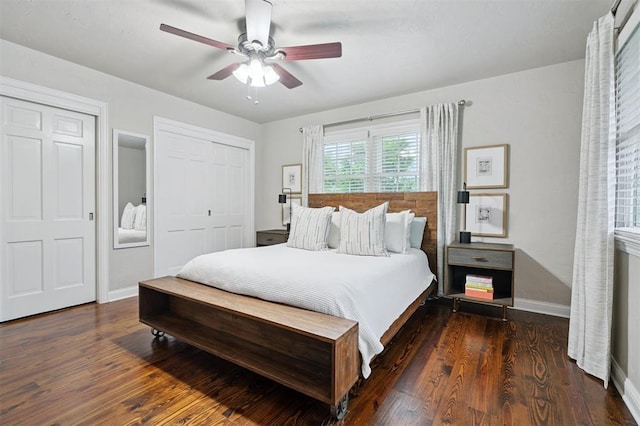 2633 Chaucer Dr, The Village, OK 73120 - bedroom featuring wood finished floors, two closets, and a ceiling fan