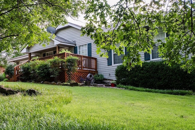 207 S Mcclure Ave, Pauls Valley, OK 73075 - view of front of property with a front lawn and a wooden deck