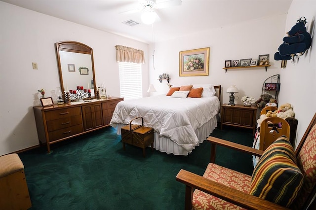 207 S Mcclure Ave, Pauls Valley, OK 73075 - bedroom featuring dark colored carpet and a ceiling fan