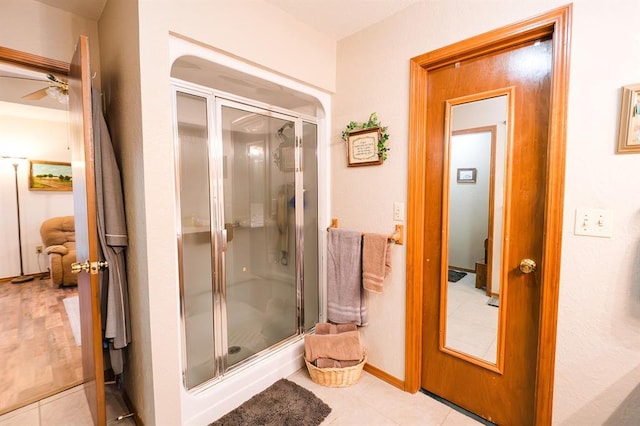 207 S Mcclure Ave, Pauls Valley, OK 73075 - full bath with a shower stall, ceiling fan, and tile patterned floors