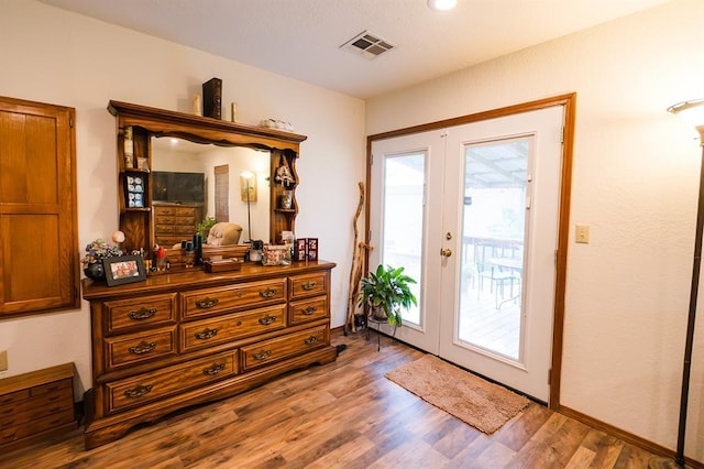 207 S Mcclure Ave, Pauls Valley, OK 73075 - doorway featuring wood finished floors and french doors