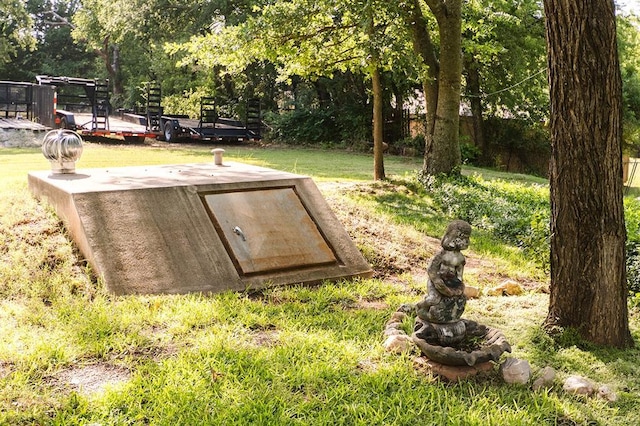 207 S Mcclure Ave, Pauls Valley, OK 73075 - entry to storm shelter with a lawn