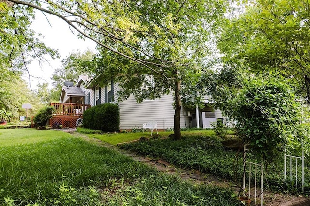 207 S Mcclure Ave, Pauls Valley, OK 73075 - view of grassy yard featuring a deck