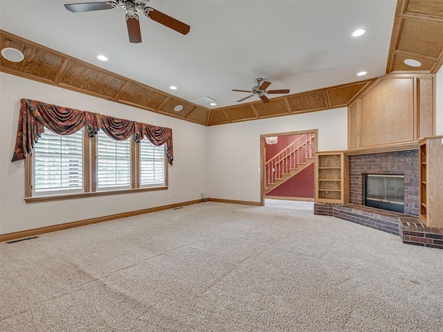 1602 N Davis Ave, Oklahoma City, OK 73127 - unfurnished living room featuring a ceiling fan, carpet, stairway, recessed lighting, and a brick fireplace