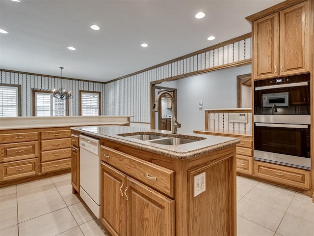 1602 N Davis Ave, Oklahoma City, OK 73127 - kitchen featuring white dishwasher, ornamental molding, light tile patterned flooring, a center island with sink, and a chandelier