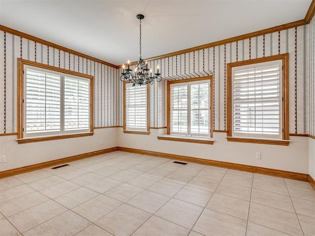 1602 N Davis Ave, Oklahoma City, OK 73127 - spare room with crown molding, a chandelier, and wallpapered walls