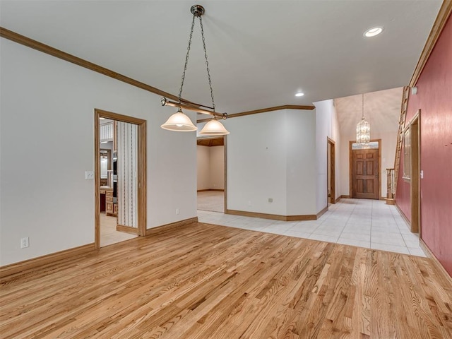 1602 N Davis Ave, Oklahoma City, OK 73127 - unfurnished living room featuring ornamental molding, a chandelier, light wood-type flooring, and recessed lighting
