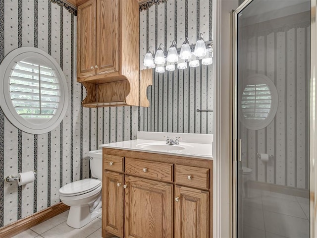 1602 N Davis Ave, Oklahoma City, OK 73127 - bathroom featuring wallpapered walls, tile patterned floors, and vanity
