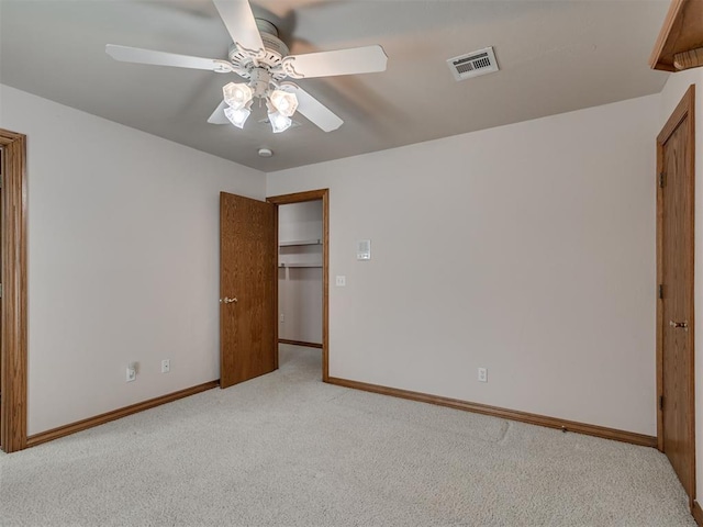 1602 N Davis Ave, Oklahoma City, OK 73127 - unfurnished bedroom featuring light colored carpet and a ceiling fan