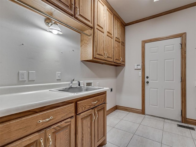 1602 N Davis Ave, Oklahoma City, OK 73127 - laundry area featuring electric dryer hookup, hookup for a washing machine, ornamental molding, light tile patterned floors, and cabinet space