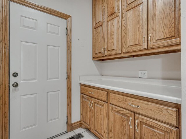 1602 N Davis Ave, Oklahoma City, OK 73127 - laundry area with light tile patterned flooring