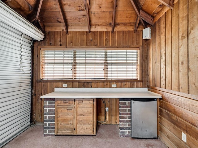 1602 N Davis Ave, Oklahoma City, OK 73127 - unfurnished office featuring wood walls, healthy amount of natural light, and wooden ceiling