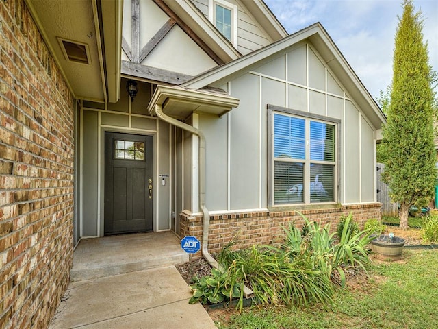 8612 SW 36th Ter, Oklahoma City, OK 73179 - property entrance featuring brick siding and board and batten siding