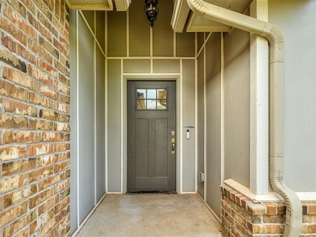 8612 SW 36th Ter, Oklahoma City, OK 73179 - doorway to property featuring brick siding and stucco siding