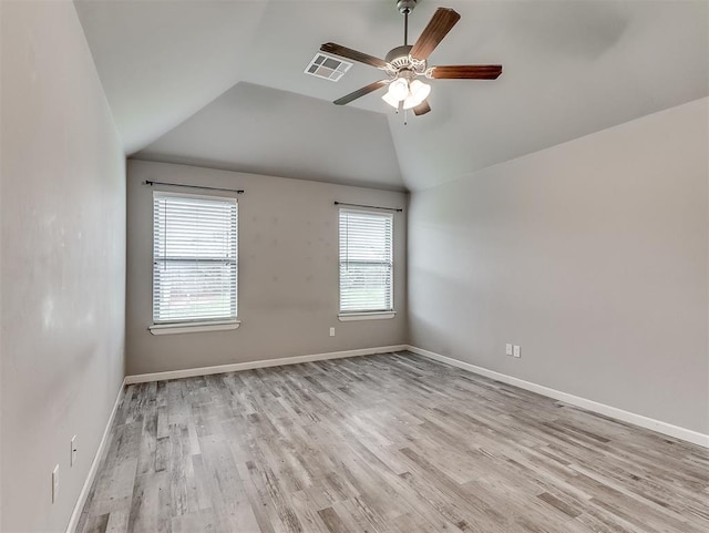 8612 SW 36th Ter, Oklahoma City, OK 73179 - spare room featuring ceiling fan, light wood-type flooring, and vaulted ceiling