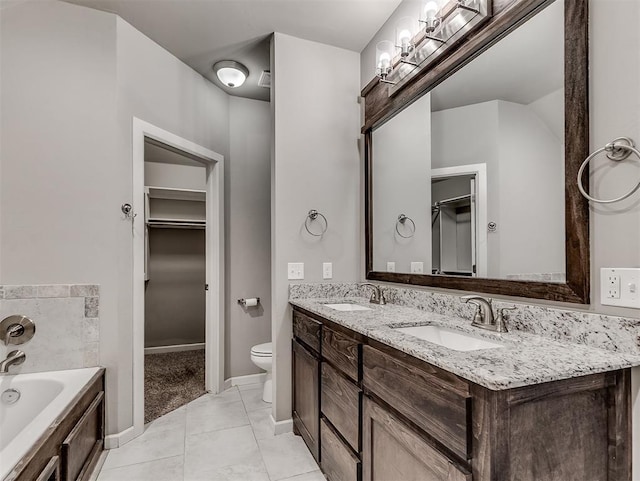 8612 SW 36th Ter, Oklahoma City, OK 73179 - full bath featuring a bath, double vanity, a spacious closet, and tile patterned flooring