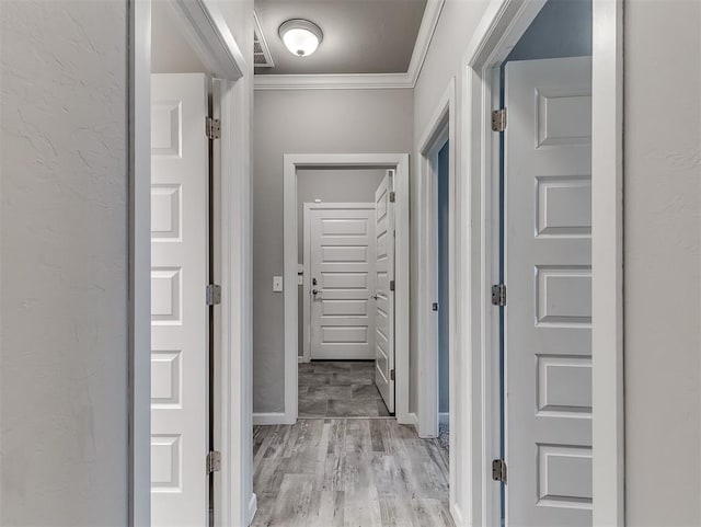 8612 SW 36th Ter, Oklahoma City, OK 73179 - hall featuring crown molding and light wood finished floors