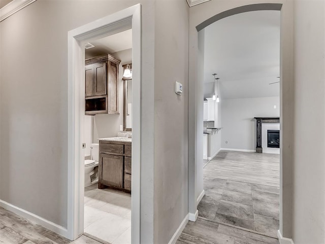 8612 SW 36th Ter, Oklahoma City, OK 73179 - hallway featuring arched walkways and baseboards