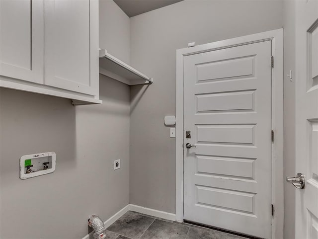 8612 SW 36th Ter, Oklahoma City, OK 73179 - laundry room featuring cabinet space, electric dryer hookup, hookup for a washing machine, and dark tile patterned flooring