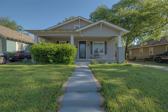 615 NW 26th St, Oklahoma City, OK 73103 - view of front of property featuring a front lawn and covered porch