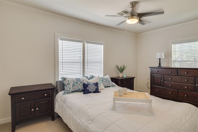 615 NW 26th St, Oklahoma City, OK 73103 - bedroom with crown molding, light colored carpet, and ceiling fan