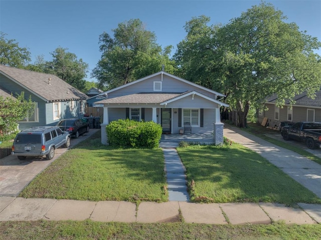 615 NW 26th St, Oklahoma City, OK 73103 - bungalow-style house with covered porch and a front lawn
