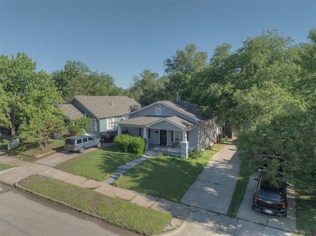 615 NW 26th St, Oklahoma City, OK 73103 - bungalow featuring concrete driveway, a porch, and a front yard