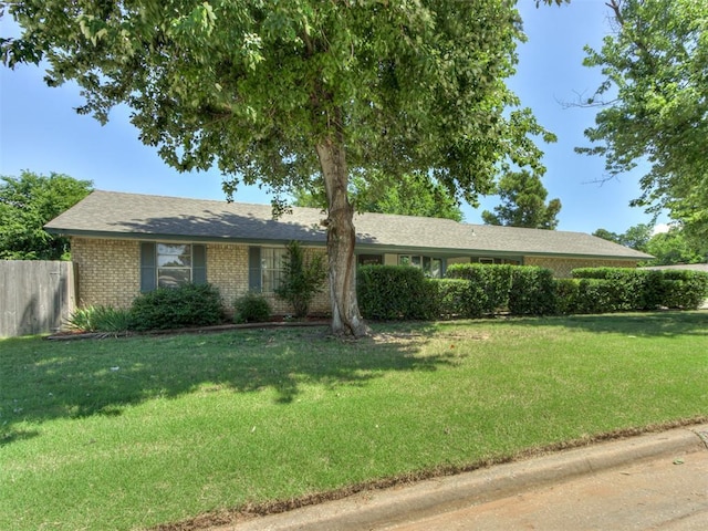 501 E Cardinal Pl, Midwest City, OK 73130 - ranch-style house featuring brick siding