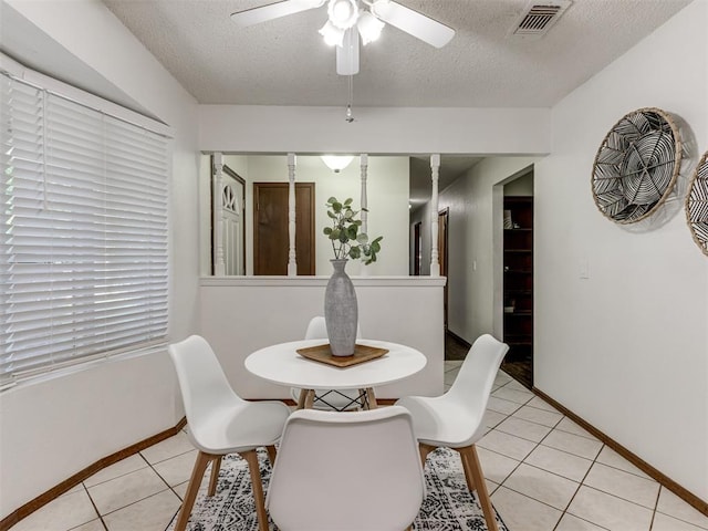 501 E Cardinal Pl, Midwest City, OK 73130 - dining room with a textured ceiling, ceiling fan, and light tile patterned floors