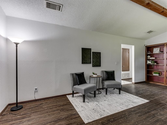 501 E Cardinal Pl, Midwest City, OK 73130 - sitting room featuring wood finished floors and a textured ceiling