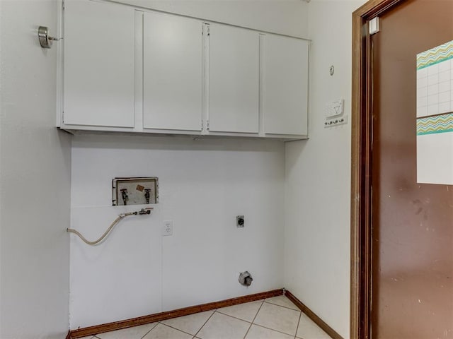 501 E Cardinal Pl, Midwest City, OK 73130 - laundry room with hookup for a washing machine, cabinet space, hookup for an electric dryer, and light tile patterned floors