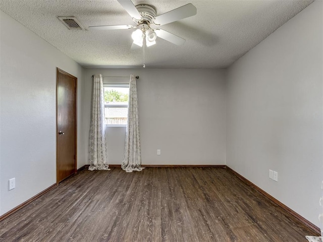501 E Cardinal Pl, Midwest City, OK 73130 - spare room with wood finished floors, ceiling fan, and a textured ceiling