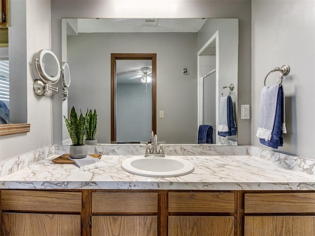 501 E Cardinal Pl, Midwest City, OK 73130 - full bathroom featuring vanity, ceiling fan, and an enclosed shower