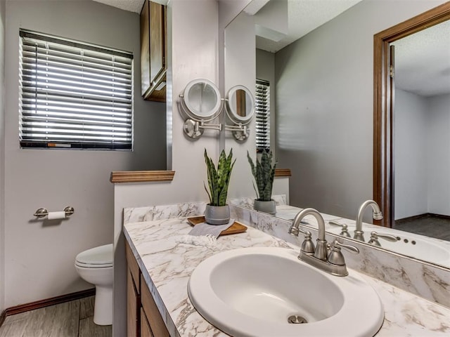 501 E Cardinal Pl, Midwest City, OK 73130 - bathroom with vanity and wood finished floors