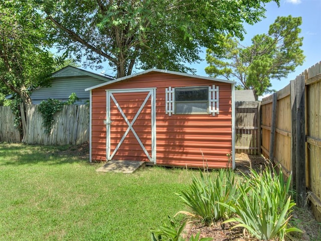 501 E Cardinal Pl, Midwest City, OK 73130 - view of shed with a fenced backyard