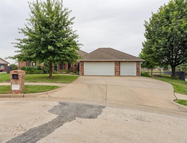 8404 NW 65th Pl, Oklahoma City, OK 73132 - view of front of house with an attached garage, brick siding, and driveway