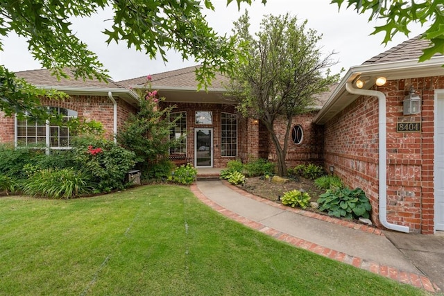 8404 NW 65th Pl, Oklahoma City, OK 73132 - entrance to property with brick siding and a yard