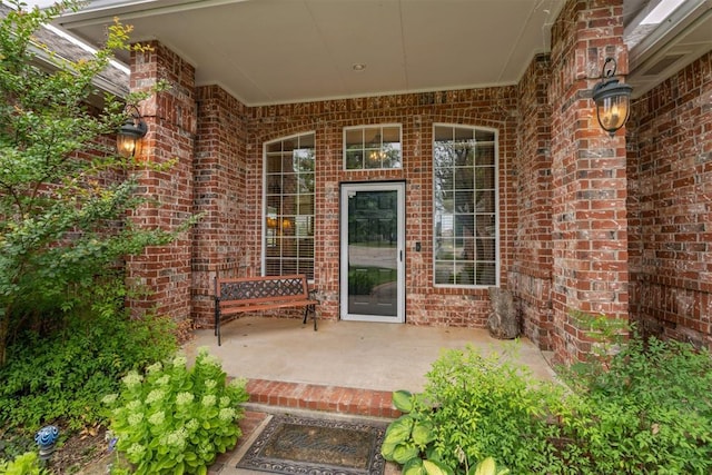 8404 NW 65th Pl, Oklahoma City, OK 73132 - entrance to property featuring brick siding and a patio