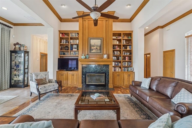8404 NW 65th Pl, Oklahoma City, OK 73132 - living area with a ceiling fan, ornamental molding, wood finished floors, a fireplace, and recessed lighting