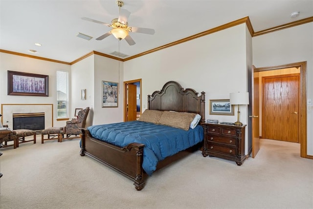 8404 NW 65th Pl, Oklahoma City, OK 73132 - bedroom with light carpet, crown molding, a glass covered fireplace, and ceiling fan