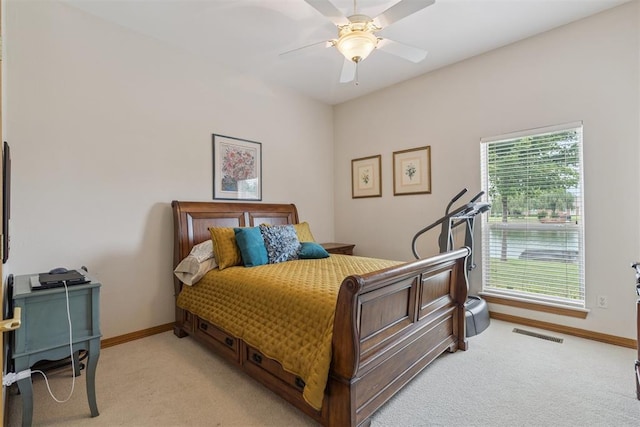 8404 NW 65th Pl, Oklahoma City, OK 73132 - bedroom featuring light carpet and a ceiling fan