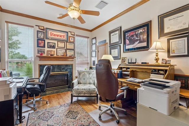 8404 NW 65th Pl, Oklahoma City, OK 73132 - office space featuring wood finished floors, a ceiling fan, crown molding, and a high end fireplace