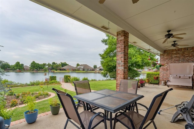 8404 NW 65th Pl, Oklahoma City, OK 73132 - view of patio / terrace with outdoor dining space, a ceiling fan, and a water view