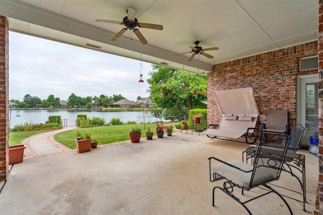 8404 NW 65th Pl, Oklahoma City, OK 73132 - view of patio / terrace featuring a water view and ceiling fan