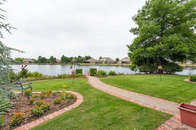 8404 NW 65th Pl, Oklahoma City, OK 73132 - view of community featuring a water view and a lawn