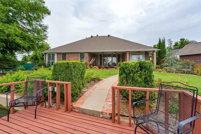 8404 NW 65th Pl, Oklahoma City, OK 73132 - wooden deck with a ceiling fan and a lawn