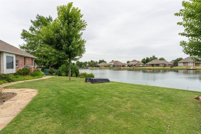 8404 NW 65th Pl, Oklahoma City, OK 73132 - view of green lawn with a water view and a residential view